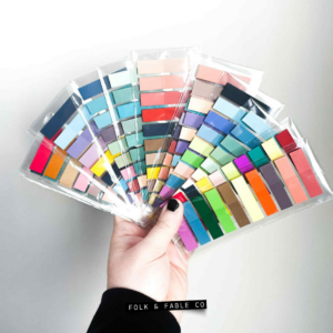 Colorful annotating tabs fanned out in someone's hand.