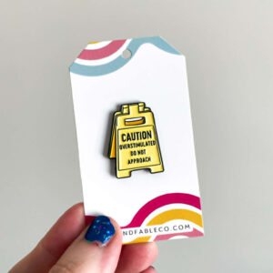 CAUTION ENAMEL PIN
