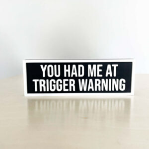 TRIGGER WARNINGS BOOKSHELF SIGN
