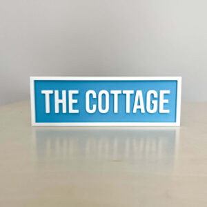 THE COTTAGE BOOKSHELF SIGN LIGHT BLUE