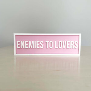 ENEMEIES TO LOVERS BOOKSHELF SIGN LIGHT PINK