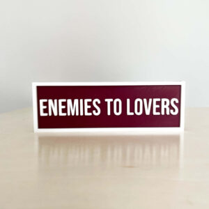ENEMEIES TO LOVERS BOOKSHELF SIGN MAROON